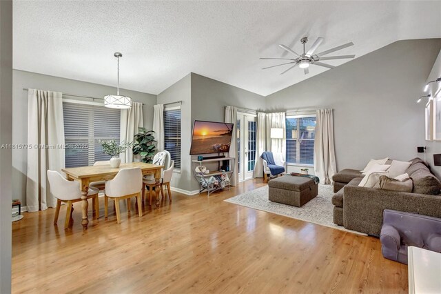 9012 Lake Park Cir S, Davie, FL 33328 - living area featuring vaulted ceiling, wood finished floors, ceiling fan, and baseboards