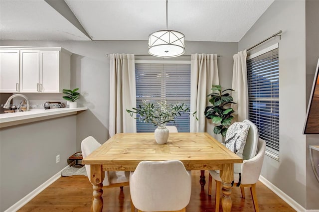 9012 Lake Park Cir S, Davie, FL 33328 - dining area featuring baseboards and light wood-style flooring