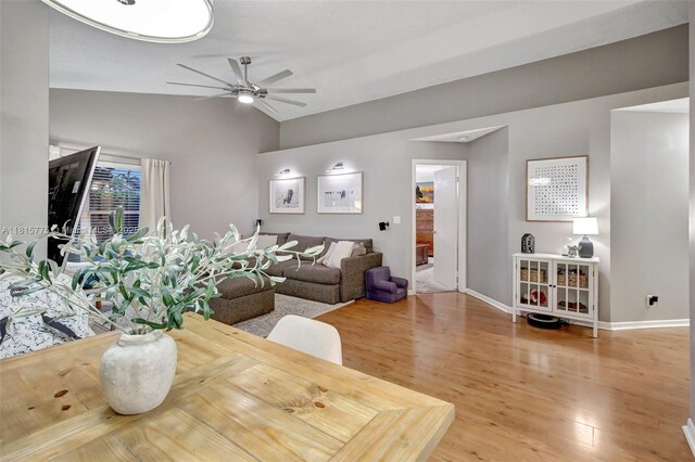 9012 Lake Park Cir S, Davie, FL 33328 - dining room featuring vaulted ceiling, ceiling fan, wood finished floors, and baseboards