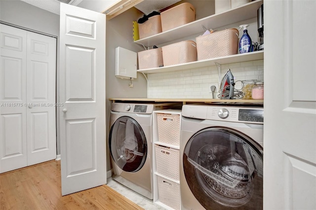 9012 Lake Park Cir S, Davie, FL 33328 - washroom with independent washer and dryer and light wood finished floors