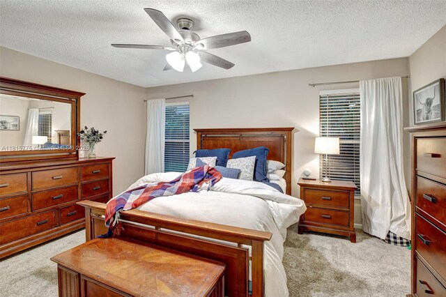 9012 Lake Park Cir S, Davie, FL 33328 - bedroom featuring light carpet, a textured ceiling, and ceiling fan