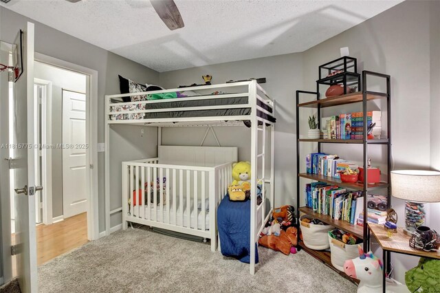 9012 Lake Park Cir S, Davie, FL 33328 - carpeted bedroom with a textured ceiling and ceiling fan