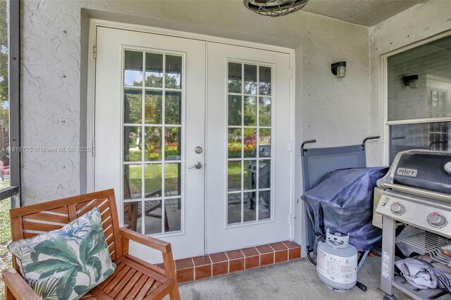 9012 Lake Park Cir S, Davie, FL 33328 - property entrance with french doors and stucco siding
