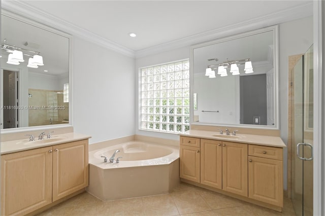 7215 Great Falls Cir, Boynton Beach, FL 33437 - bathroom with two vanities, tile patterned floors, a shower stall, a bath, and ornamental molding
