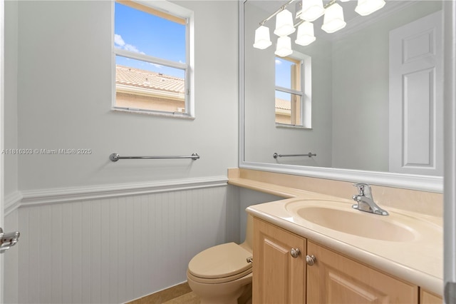 7215 Great Falls Cir, Boynton Beach, FL 33437 - bathroom featuring wainscoting, plenty of natural light, vanity, and toilet