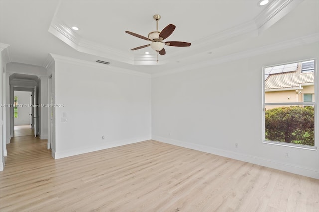 7215 Great Falls Cir, Boynton Beach, FL 33437 - unfurnished room featuring a tray ceiling, light wood finished floors, crown molding, a ceiling fan, and recessed lighting