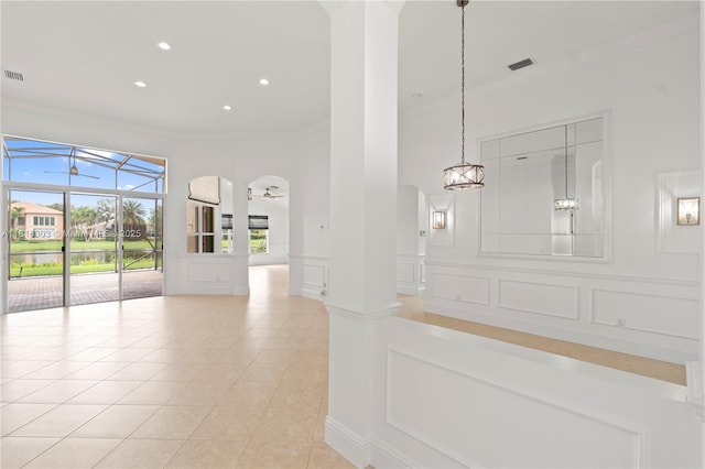 7215 Great Falls Cir, Boynton Beach, FL 33437 - hall featuring ornamental molding, arched walkways, light tile patterned floors, recessed lighting, and a decorative wall