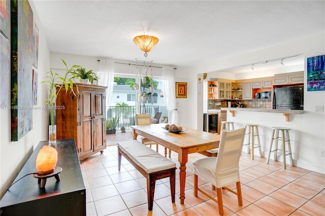1455 W Ave Unit 202, Miami Beach, FL 33139 - dining room with light tile patterned floors and rail lighting