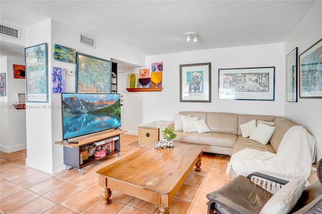 1455 W Ave Unit 202, Miami Beach, FL 33139 - living room featuring tile patterned floors and baseboards