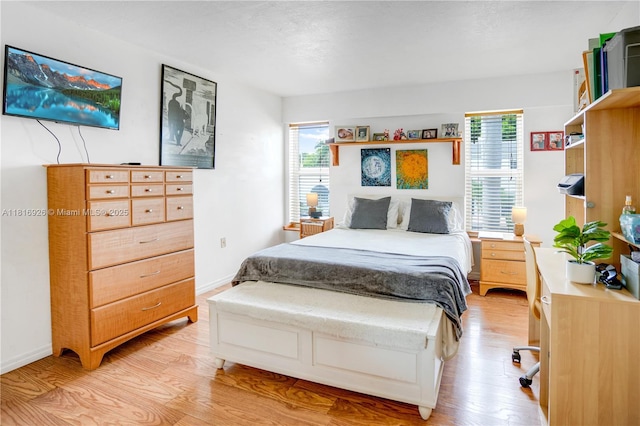 1455 W Ave Unit 202, Miami Beach, FL 33139 - bedroom featuring light wood-type flooring and baseboards