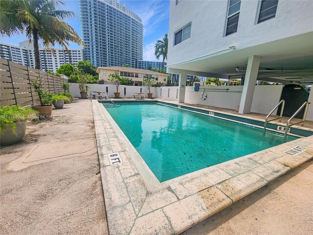 1455 W Ave Unit 202, Miami Beach, FL 33139 - community pool featuring a fenced backyard and a patio area