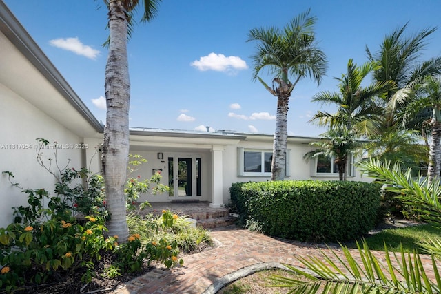 12985 Ortega Ln, North Miami, FL 33181 - view of front of home featuring stucco siding