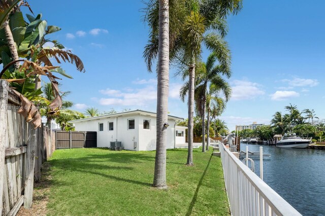 12985 Ortega Ln, North Miami, FL 33181 - view of yard featuring a water view and central AC unit