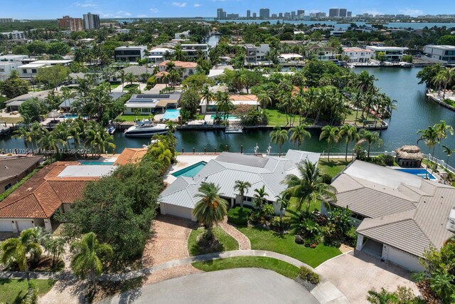 12985 Ortega Ln, North Miami, FL 33181 - aerial perspective of suburban area with a large body of water and city skyline