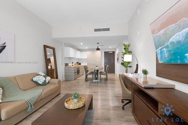 777 N Ocean Dr Unit N219, Hollywood, FL 33019 - living area featuring light wood-style flooring and recessed lighting
