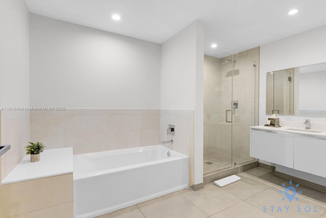 777 N Ocean Dr Unit N219, Hollywood, FL 33019 - full bath featuring tile patterned floors, vanity, a bath, a shower stall, and recessed lighting