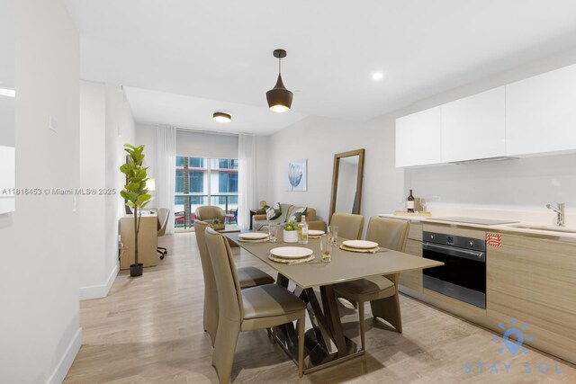 777 N Ocean Dr Unit N219, Hollywood, FL 33019 - dining room with light wood-style floors and baseboards