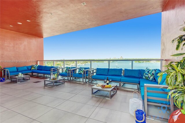 777 N Ocean Dr Unit N219, Hollywood, FL 33019 - view of patio with an outdoor hangout area and a water view