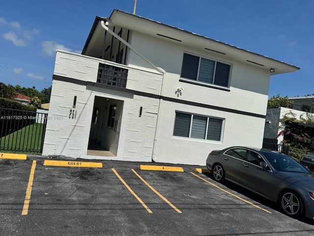251 NW 57th Ave, Miami, FL 33126 - view of building exterior featuring uncovered parking