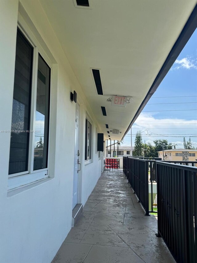 251 NW 57th Ave, Miami, FL 33126 - view of patio featuring a balcony