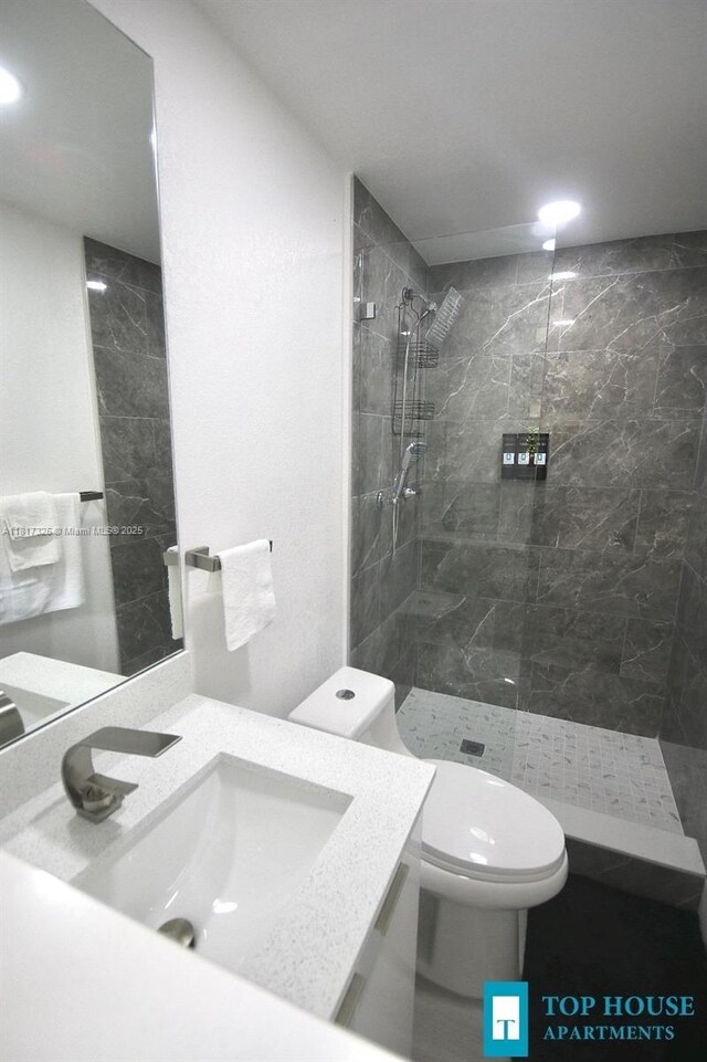 251 NW 57th Ave, Miami, FL 33126 - full bathroom featuring a tile shower, toilet, and vanity