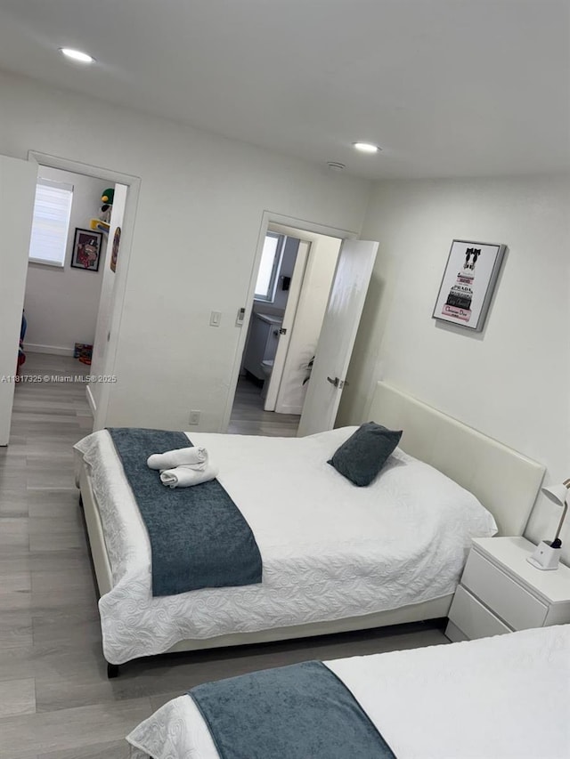 251 NW 57th Ave, Miami, FL 33126 - bedroom featuring recessed lighting, wood finished floors, and baseboards