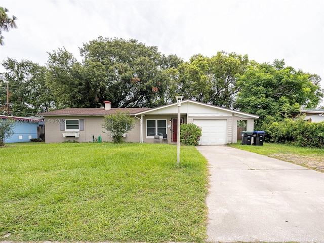 4915 Pine Needle Dr, Orlando, FL 32808 - ranch-style home with a garage, a front lawn, and driveway