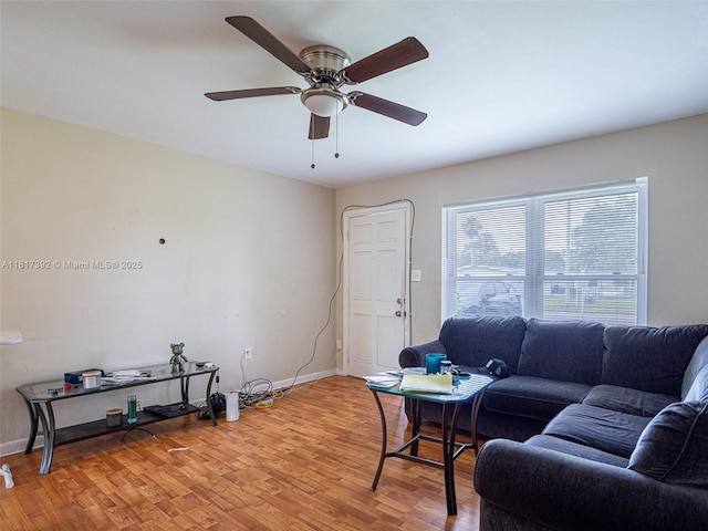 4915 Pine Needle Dr, Orlando, FL 32808 - living room featuring light wood-style floors, baseboards, and ceiling fan