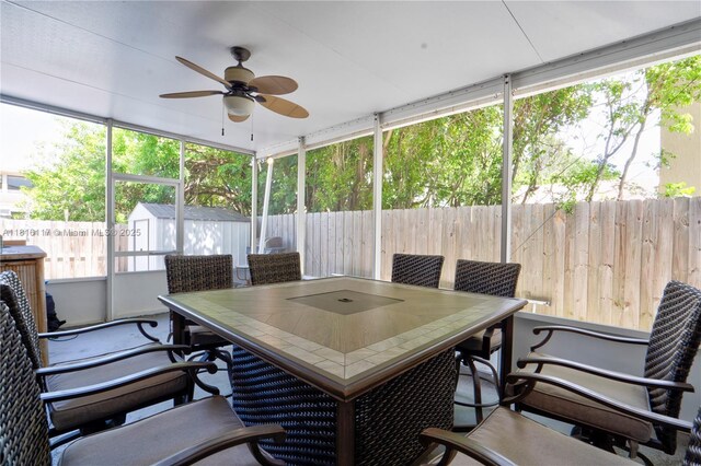 1100 SE 19th Ave, Homestead, FL 33035 - sunroom / solarium with a ceiling fan and outdoor dining space