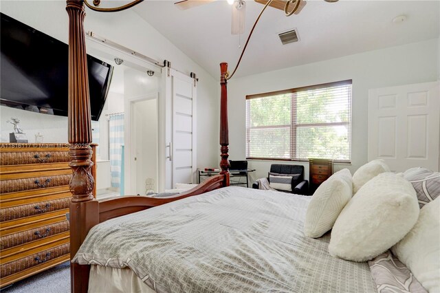 1100 SE 19th Ave, Homestead, FL 33035 - bedroom with a barn door, lofted ceiling, ceiling fan, and carpet