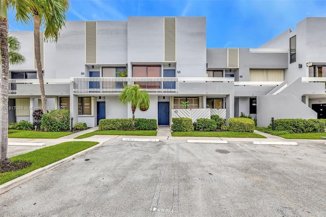 1100 SE 5th Ct Unit 87, Pompano Beach, FL 33060 - view of building exterior with uncovered parking