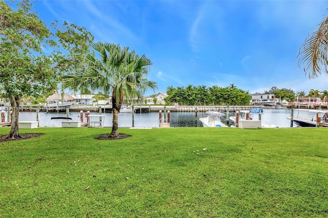 1100 SE 5th Ct Unit 87, Pompano Beach, FL 33060 - view of green lawn with a water view and a boat dock