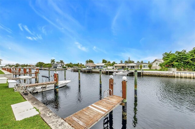 1100 SE 5th Ct Unit 87, Pompano Beach, FL 33060 - dock featuring a water view and a residential view