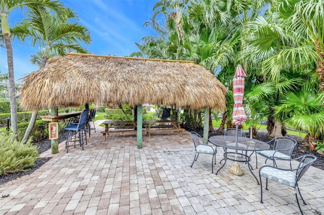 1100 SE 5th Ct Unit 87, Pompano Beach, FL 33060 - view of patio with outdoor dining area