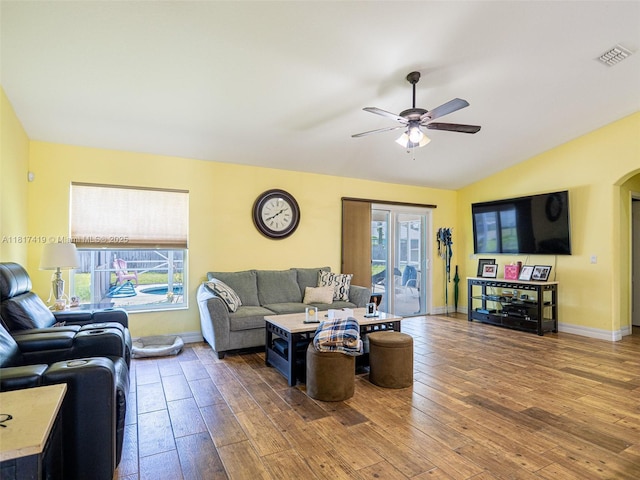 508 Arcadia Ave NE, Palm Bay, FL 32907 - living area with wood-type flooring, lofted ceiling, ceiling fan, arched walkways, and baseboards
