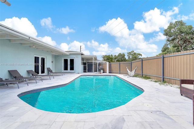 1013 S 24th Ave, Hollywood, FL 33020 - view of pool featuring french doors, a fenced backyard, a patio, and area for grilling