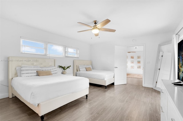 1013 S 24th Ave, Hollywood, FL 33020 - bedroom with light wood-type flooring, ceiling fan, and baseboards