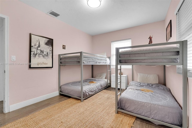 1013 S 24th Ave, Hollywood, FL 33020 - bedroom featuring wood finished floors, multiple windows, and baseboards