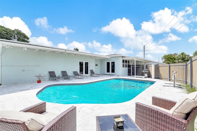 1013 S 24th Ave, Hollywood, FL 33020 - view of swimming pool with a patio, a fenced backyard, and french doors