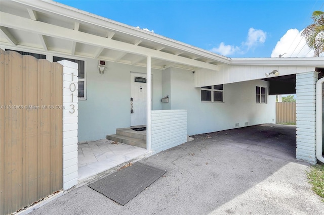1013 S 24th Ave, Hollywood, FL 33020 - doorway to property with a carport and stucco siding