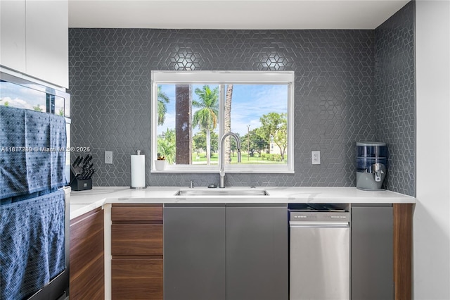 9310 Sunrise Lakes Blvd Unit 206, Sunrise, FL 33322 - kitchen with a sink, modern cabinets, light countertops, and tasteful backsplash