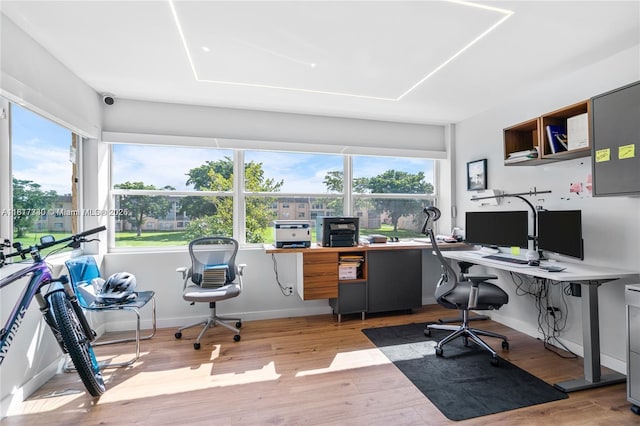 9310 Sunrise Lakes Blvd Unit 206, Sunrise, FL 33322 - home office with plenty of natural light, light wood-type flooring, and baseboards
