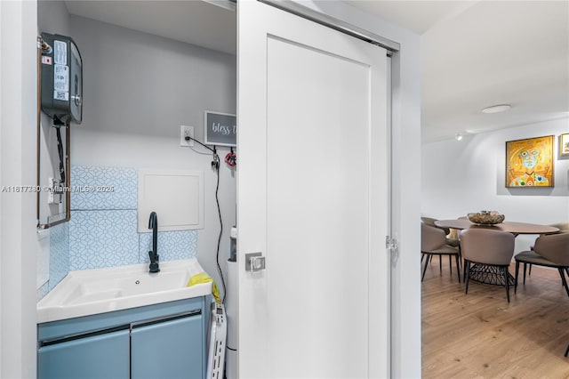 9310 Sunrise Lakes Blvd Unit 206, Sunrise, FL 33322 - washroom featuring a sink and light wood-type flooring