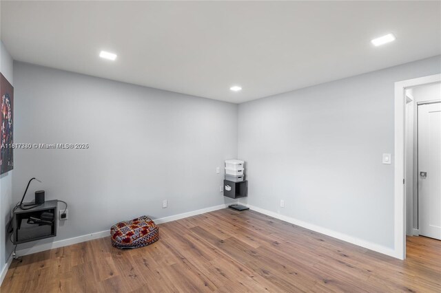9310 Sunrise Lakes Blvd Unit 206, Sunrise, FL 33322 - unfurnished room featuring wood finished floors, baseboards, and recessed lighting