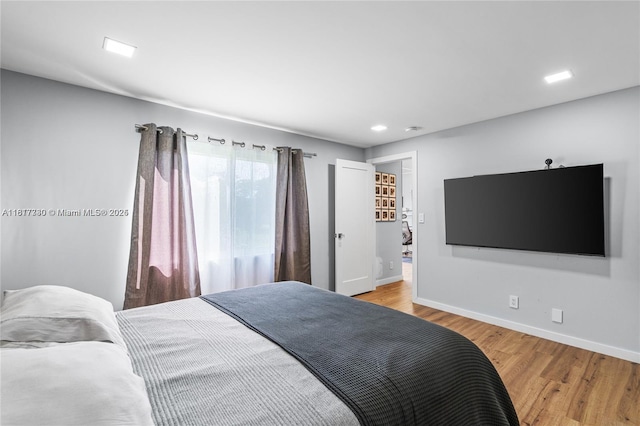 9310 Sunrise Lakes Blvd Unit 206, Sunrise, FL 33322 - bedroom with baseboards and light wood-type flooring