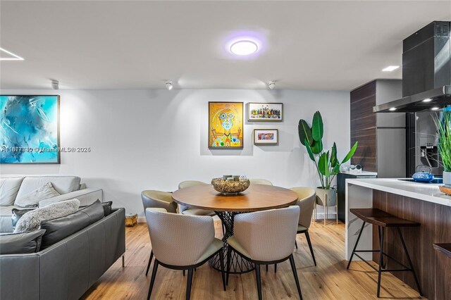 9310 Sunrise Lakes Blvd Unit 206, Sunrise, FL 33322 - dining area featuring light wood-style floors and baseboards