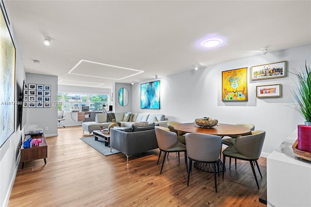 9310 Sunrise Lakes Blvd Unit 206, Sunrise, FL 33322 - dining area featuring wood finished floors and attic access