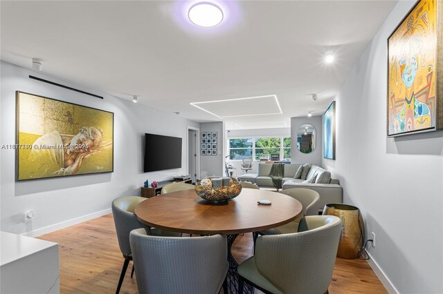 9310 Sunrise Lakes Blvd Unit 206, Sunrise, FL 33322 - dining space featuring light wood-type flooring and baseboards