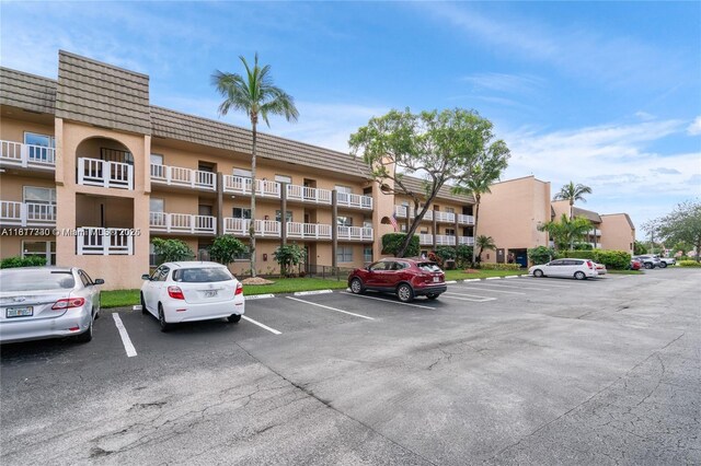 9310 Sunrise Lakes Blvd Unit 206, Sunrise, FL 33322 - view of apartment building / complex featuring uncovered parking