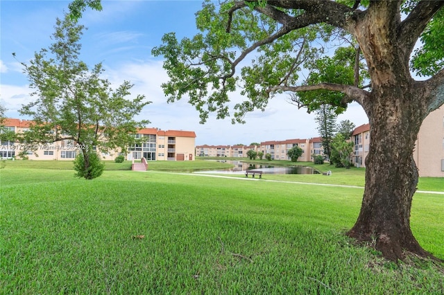 9310 Sunrise Lakes Blvd Unit 206, Sunrise, FL 33322 - surrounding community featuring a water view and a lawn
